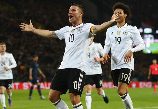 Lukas Podolski celebrates a goal on his last Germany appearance