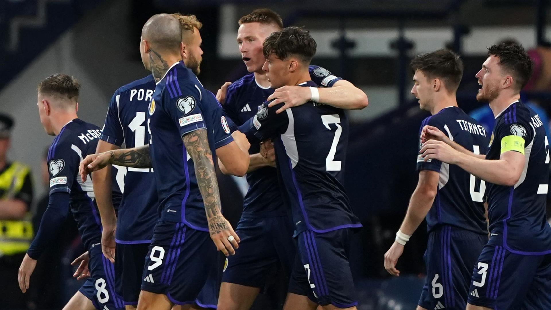 Scott McTominay (centre) celebrates scoring Scotland’s second goal (Andrew Milligan/PA)
