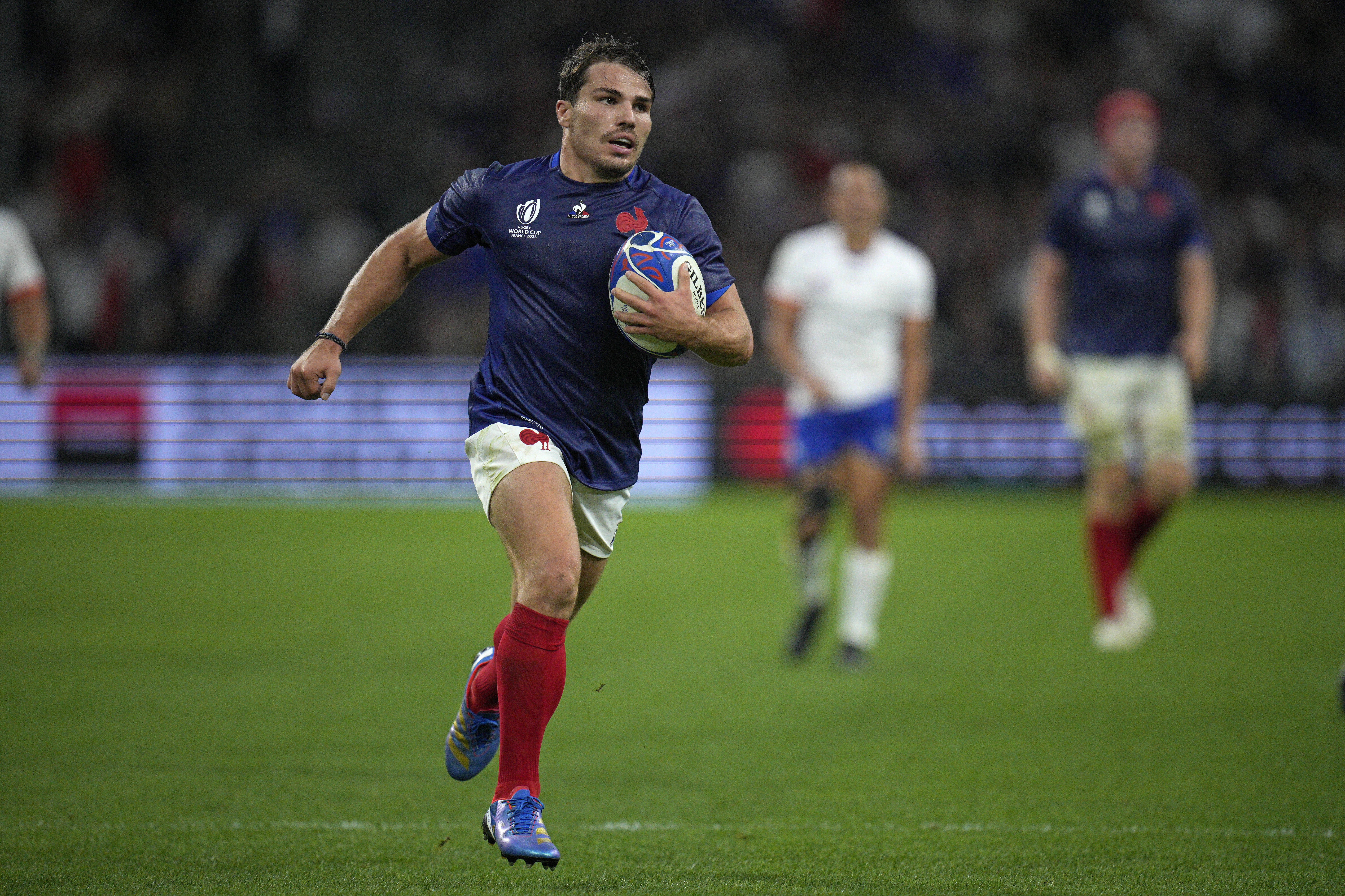 Antoine Dupont runs in for a try against Namibia