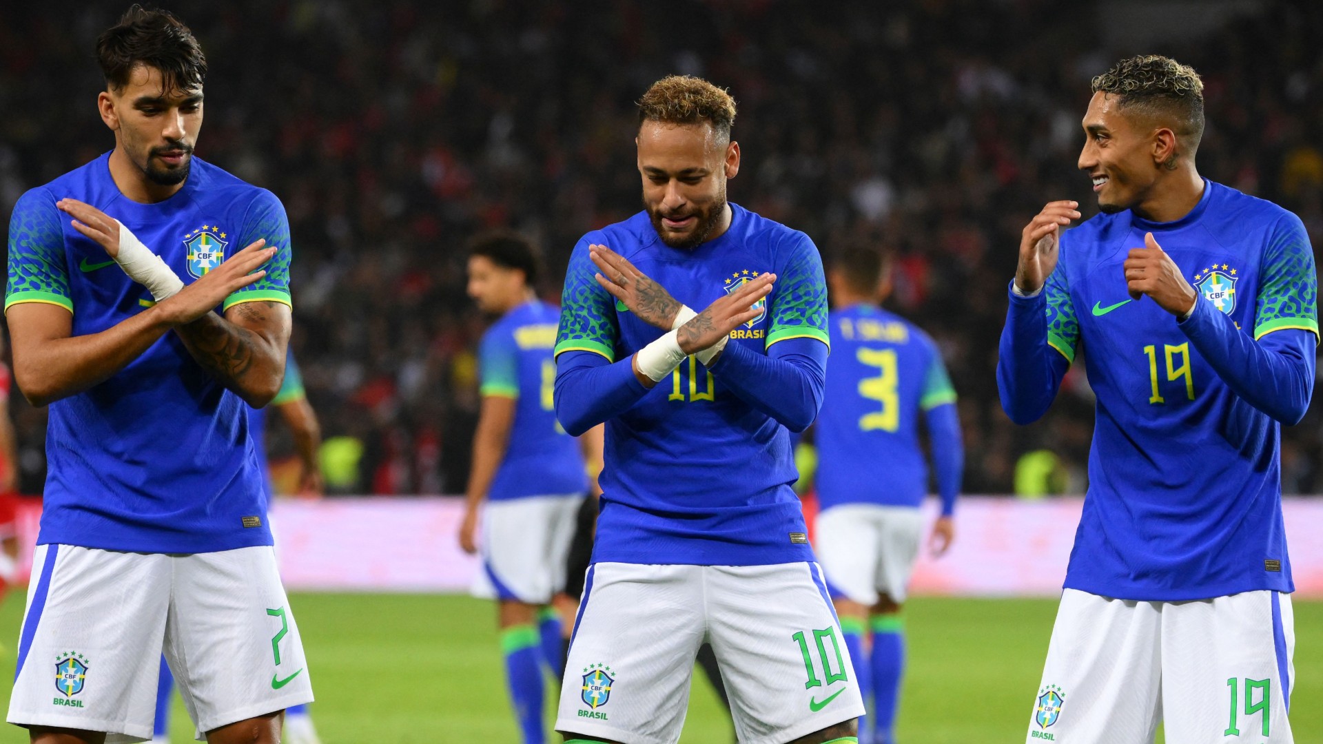 Neymar celebrates alongside Paqueta (L) and Raphinha (R)