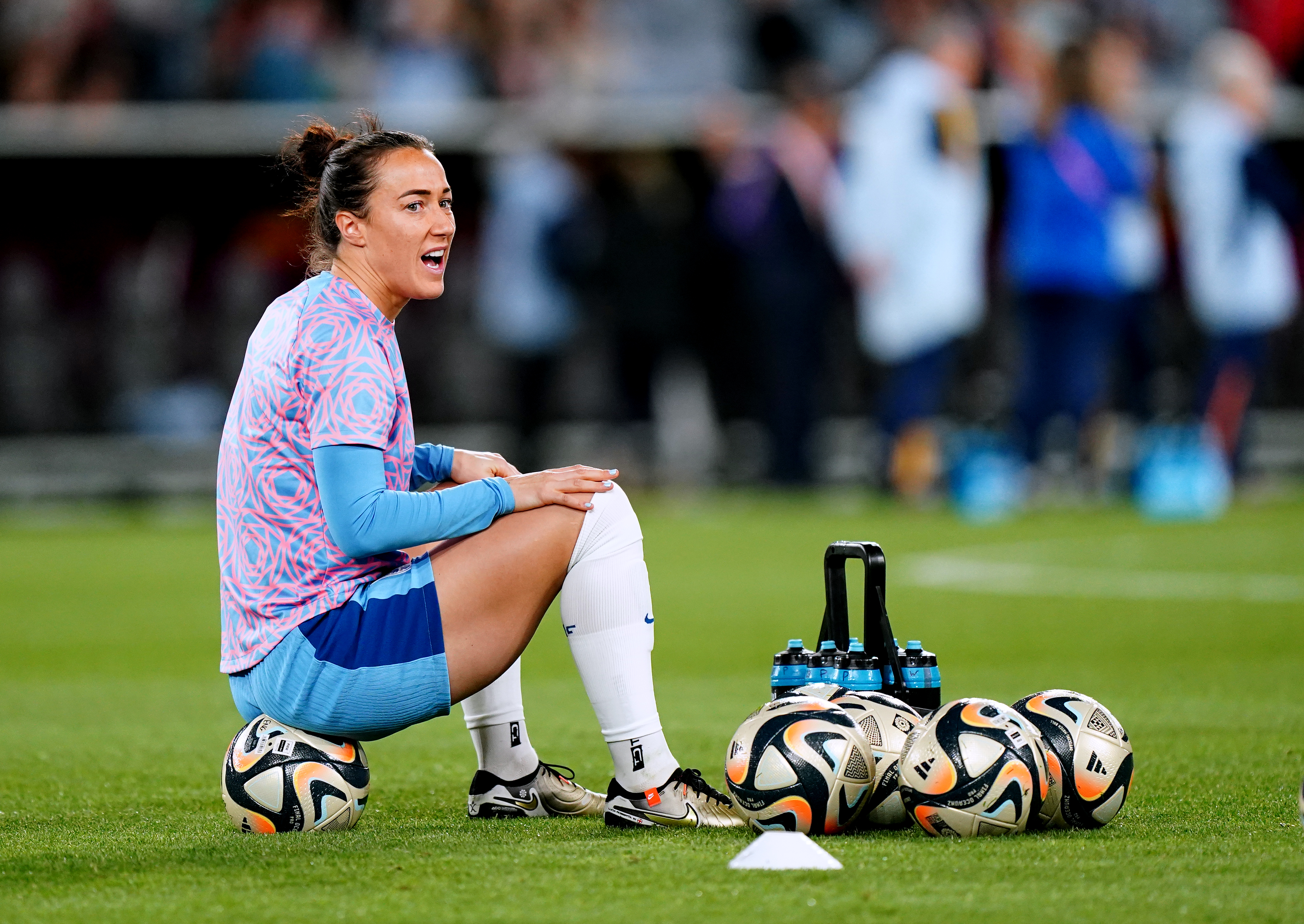Lucy Bronze sits on a ball during the warm-up in Sydney