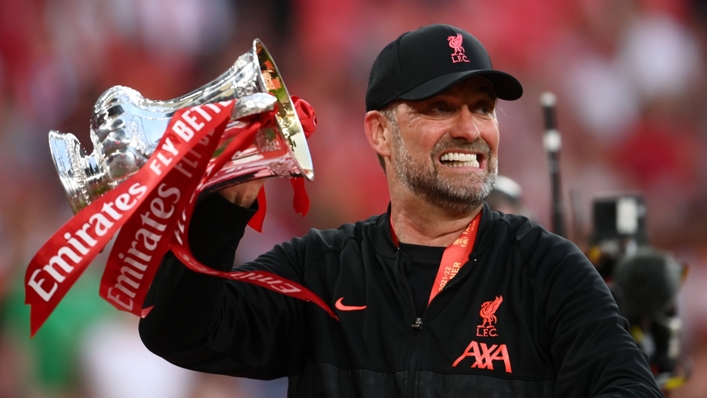 Jurgen Klopp hoists the FA Cup aloft after Liverpool's penalty shoot-out win