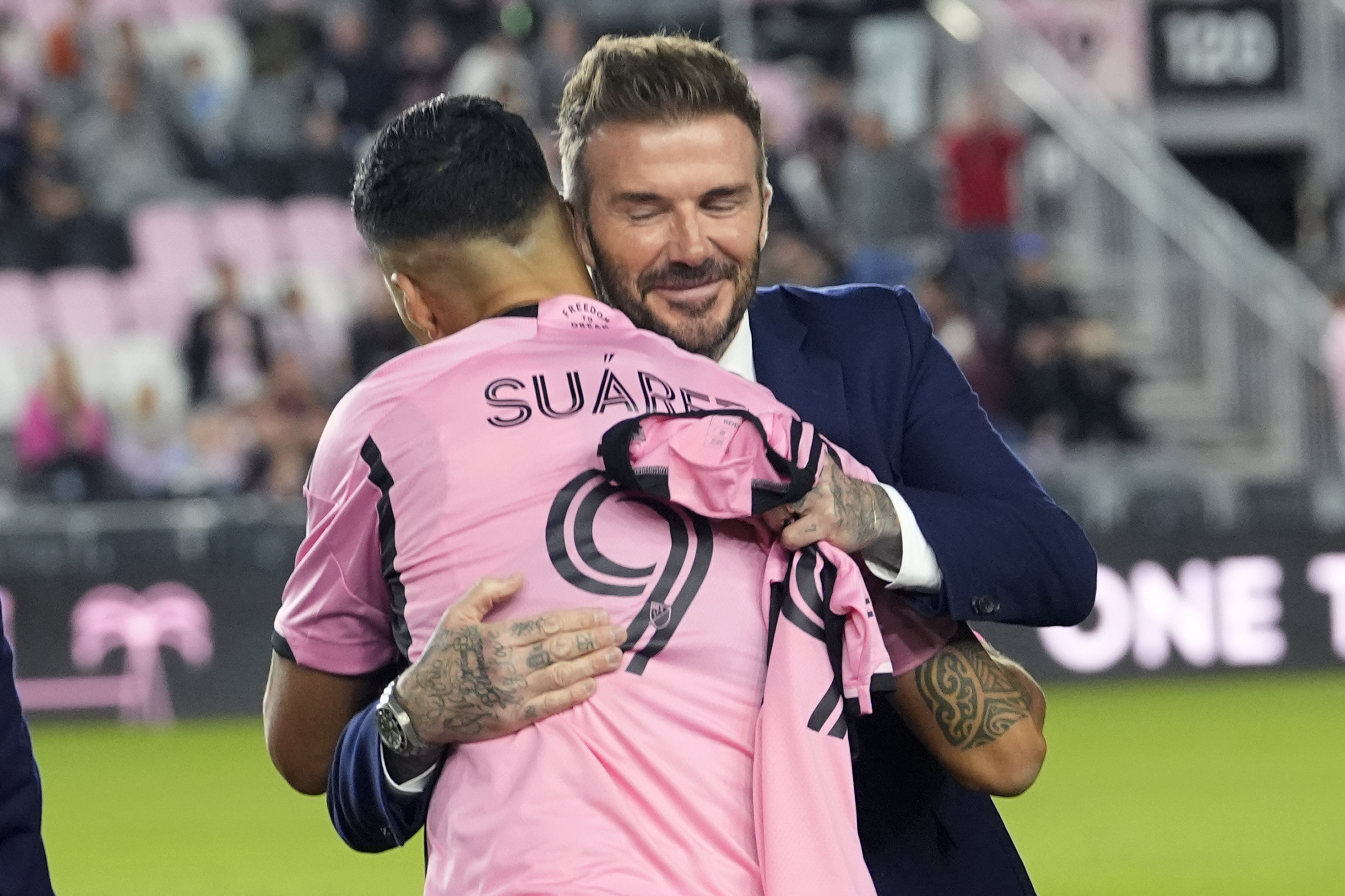 Inter Miami co-owner David Beckham hugs new signing Luis Suarez