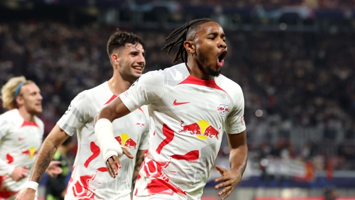 Christopher Nkunku wheels off in celebration after his first-half strike against Real Madrid