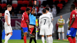 Referee Mohammed Abdulla shows Kosta Barbarouses of New Zealand a red card in the 2022 FIFA World Cup playoff  between Costa Rica and New Zealand