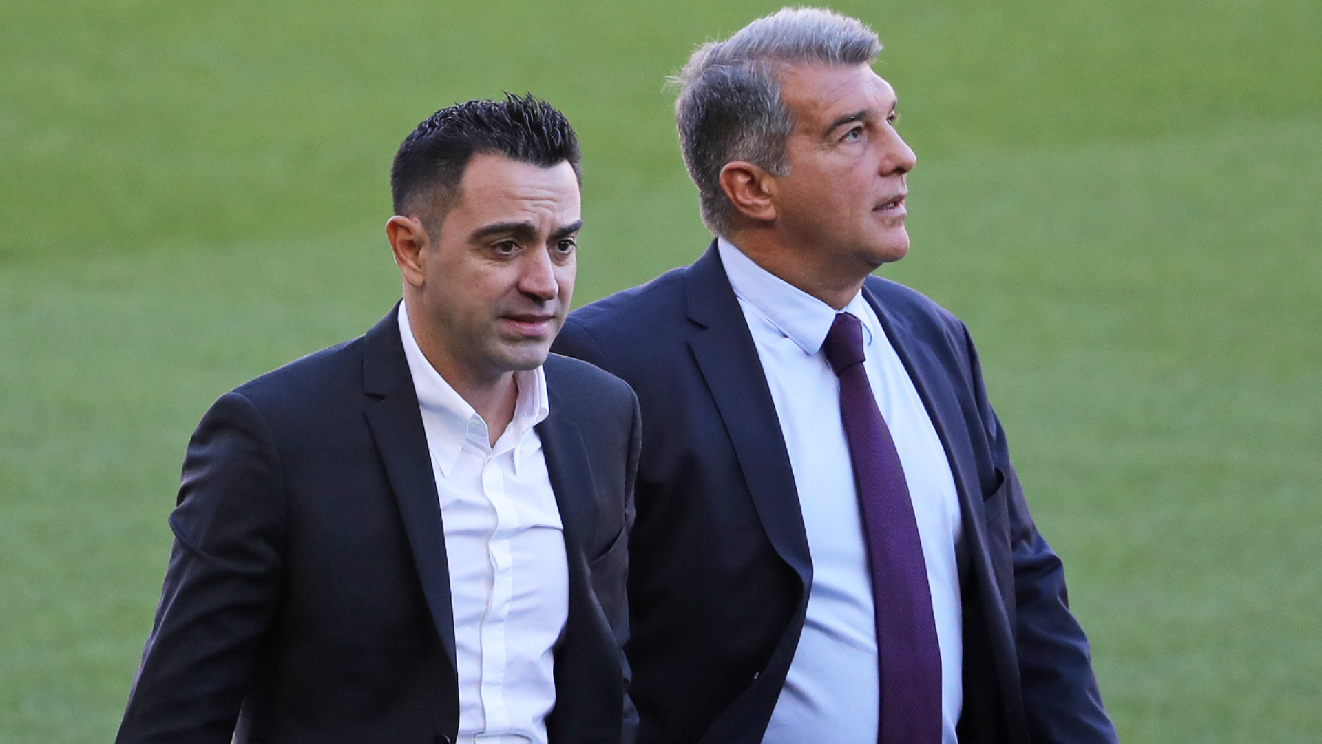 Joan Laporta (R) is delighted with Xavi's (L) work as Barcelona head coach