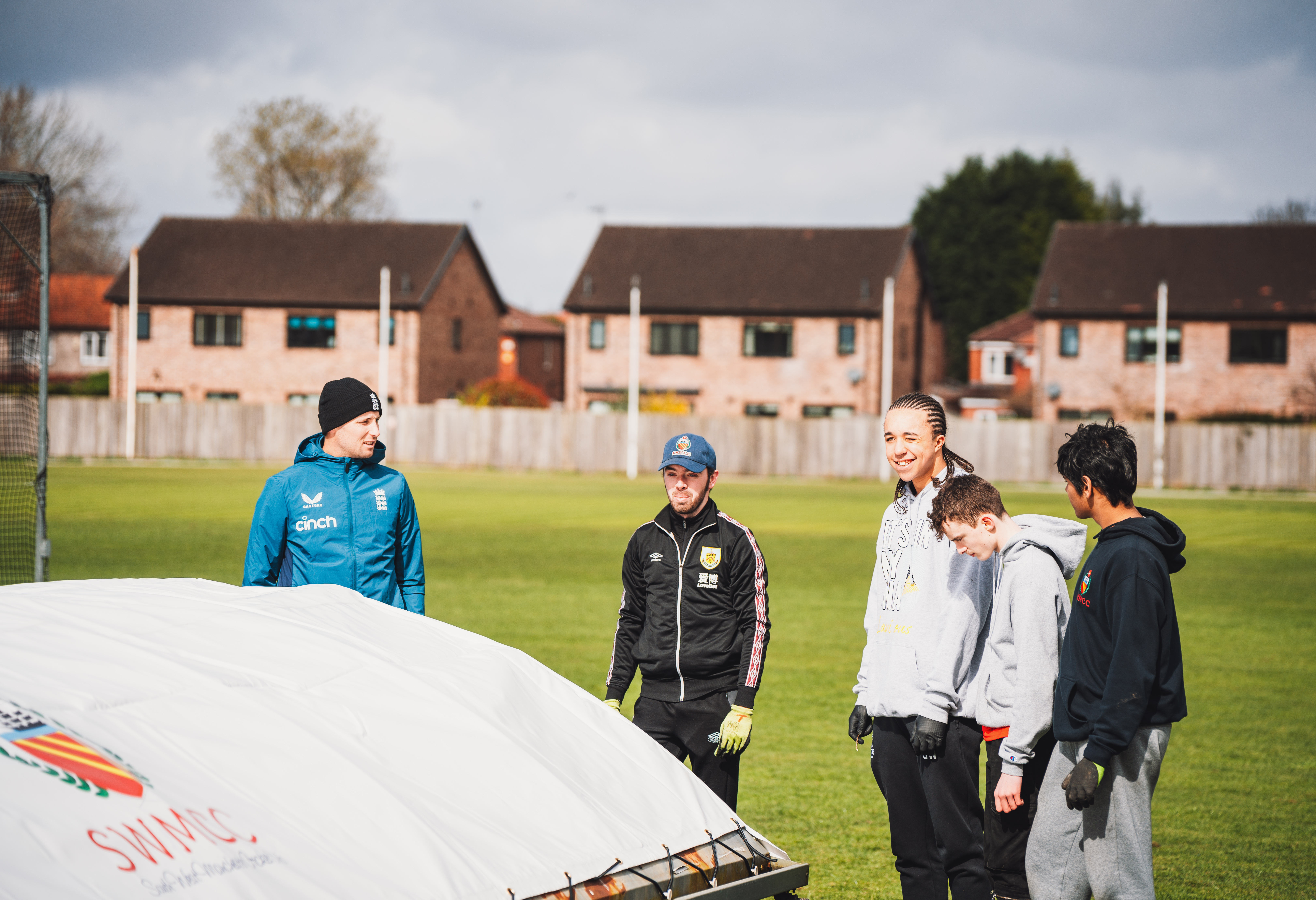Tom Hartley (left) meets club cricketers at South Manchester CC.