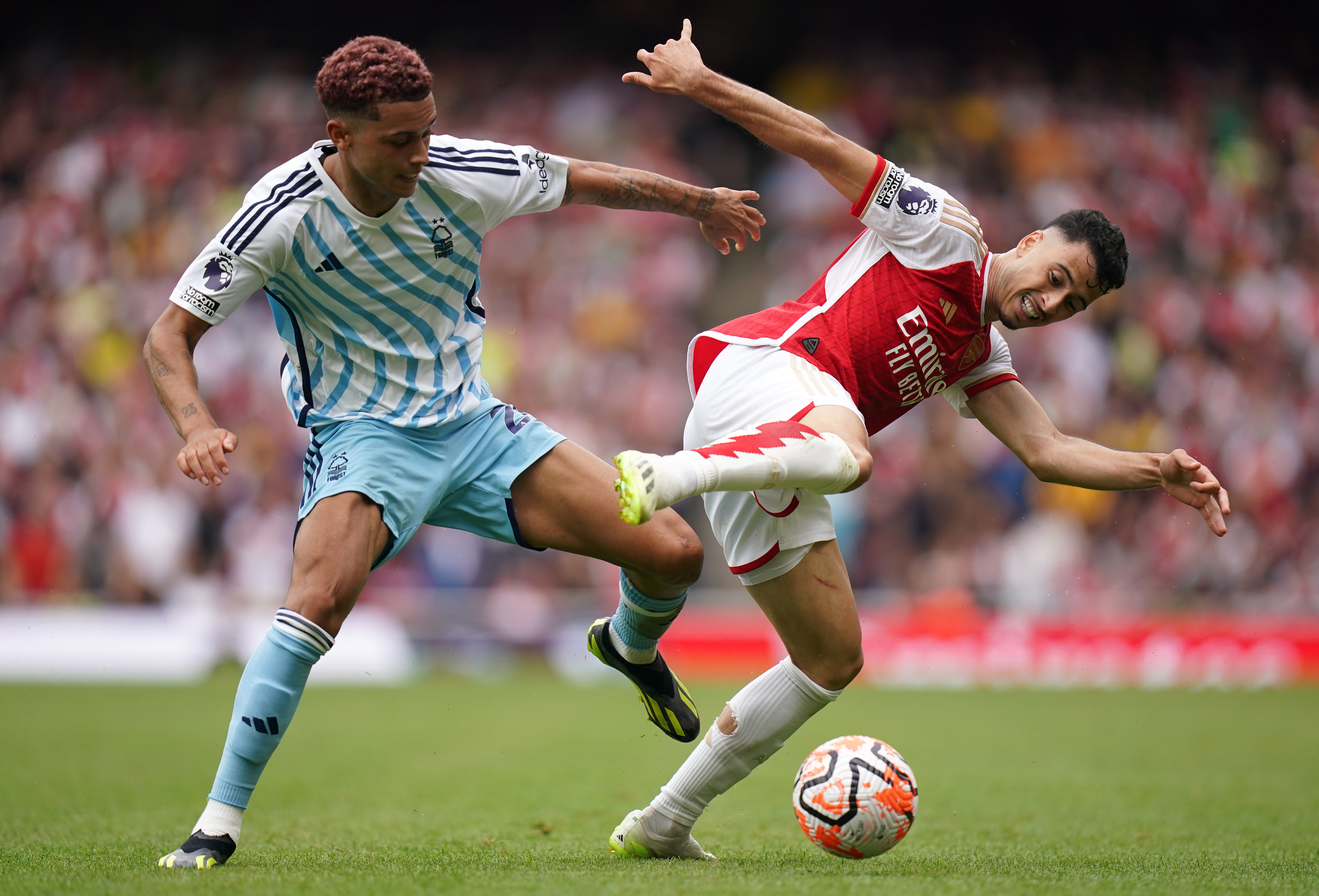 Brennan Johnson, left, battles for possession with Arsenal's Gabriel Martinelli