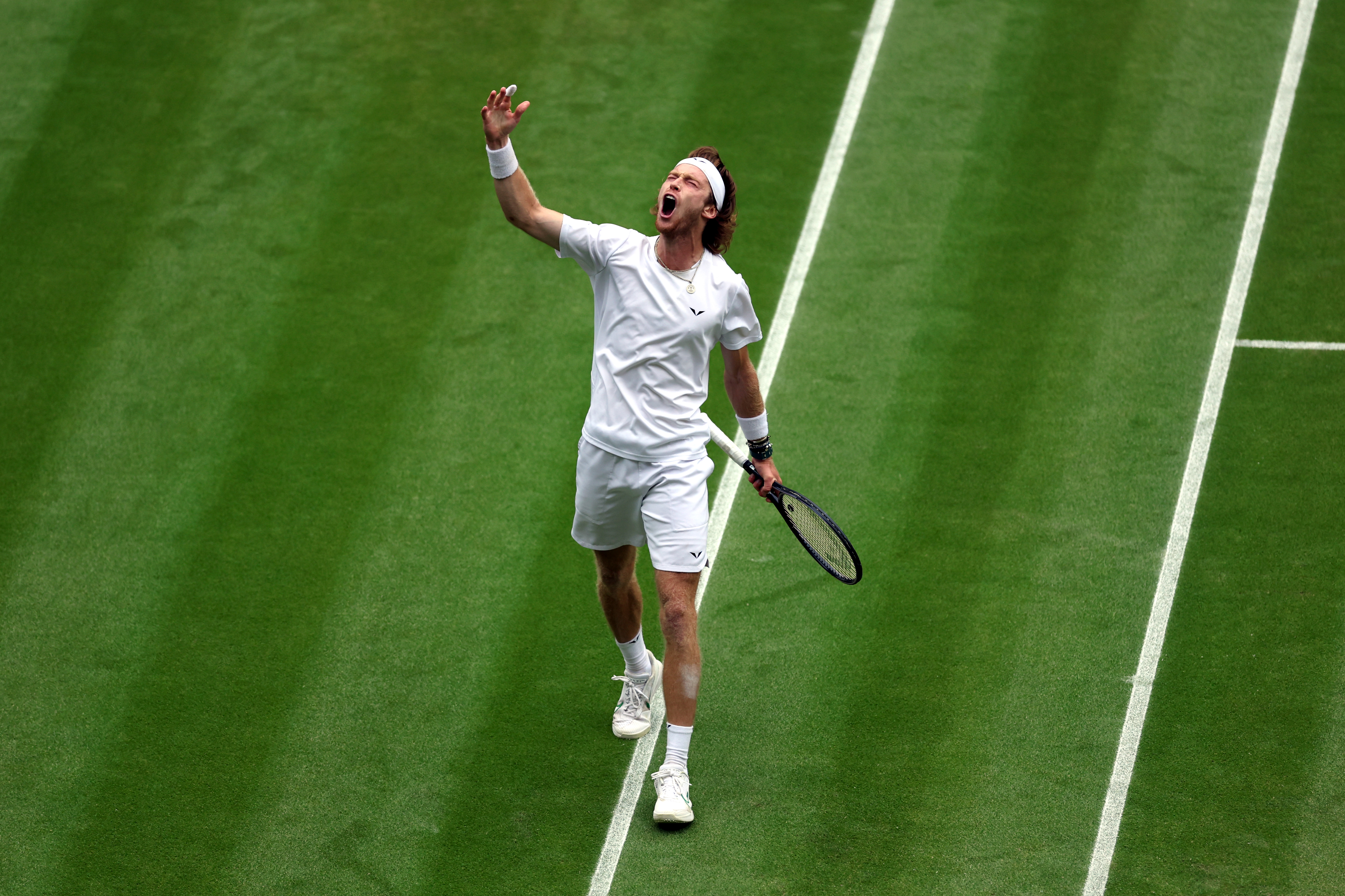 Andrey Rublev punches the air