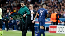 Christophe Galtier greets Kylian Mbappe after the Paris Saint-Germain forward comes off against Benfica