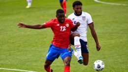 Joel Campbell of Costa Rica and Mark McKenzie of USA fight for the ball
