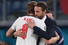 Gareth Southgate hugs England's two-goal hero Harry Kane