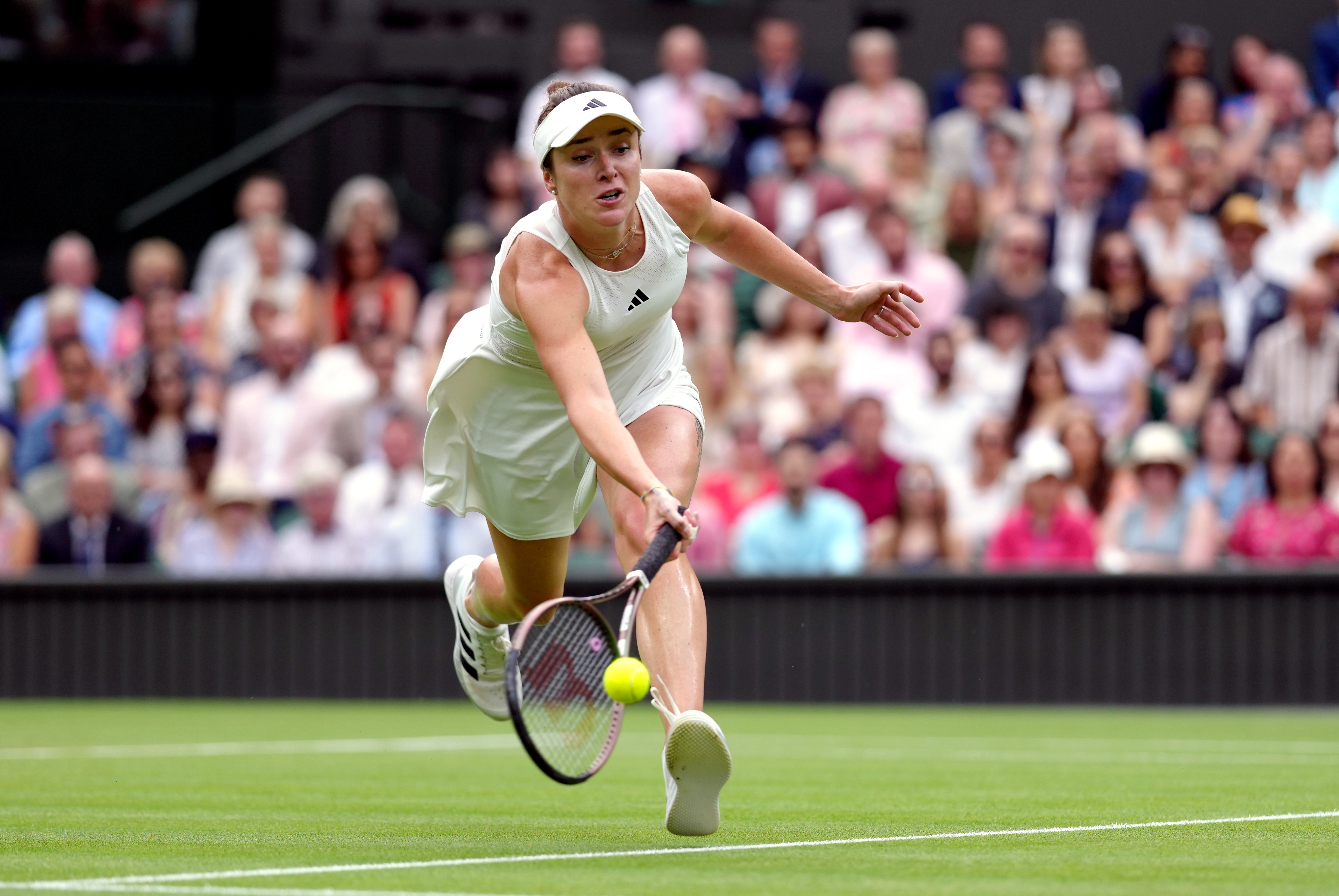 Elina Svitolina lunges for a forehand
