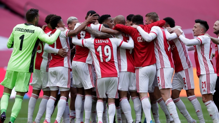 Ajax players celebrate winning the Eredivisie