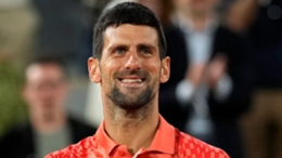 Novak Djokovic smiles after beating Marton Fucsovics (Thibault Camus/AP)