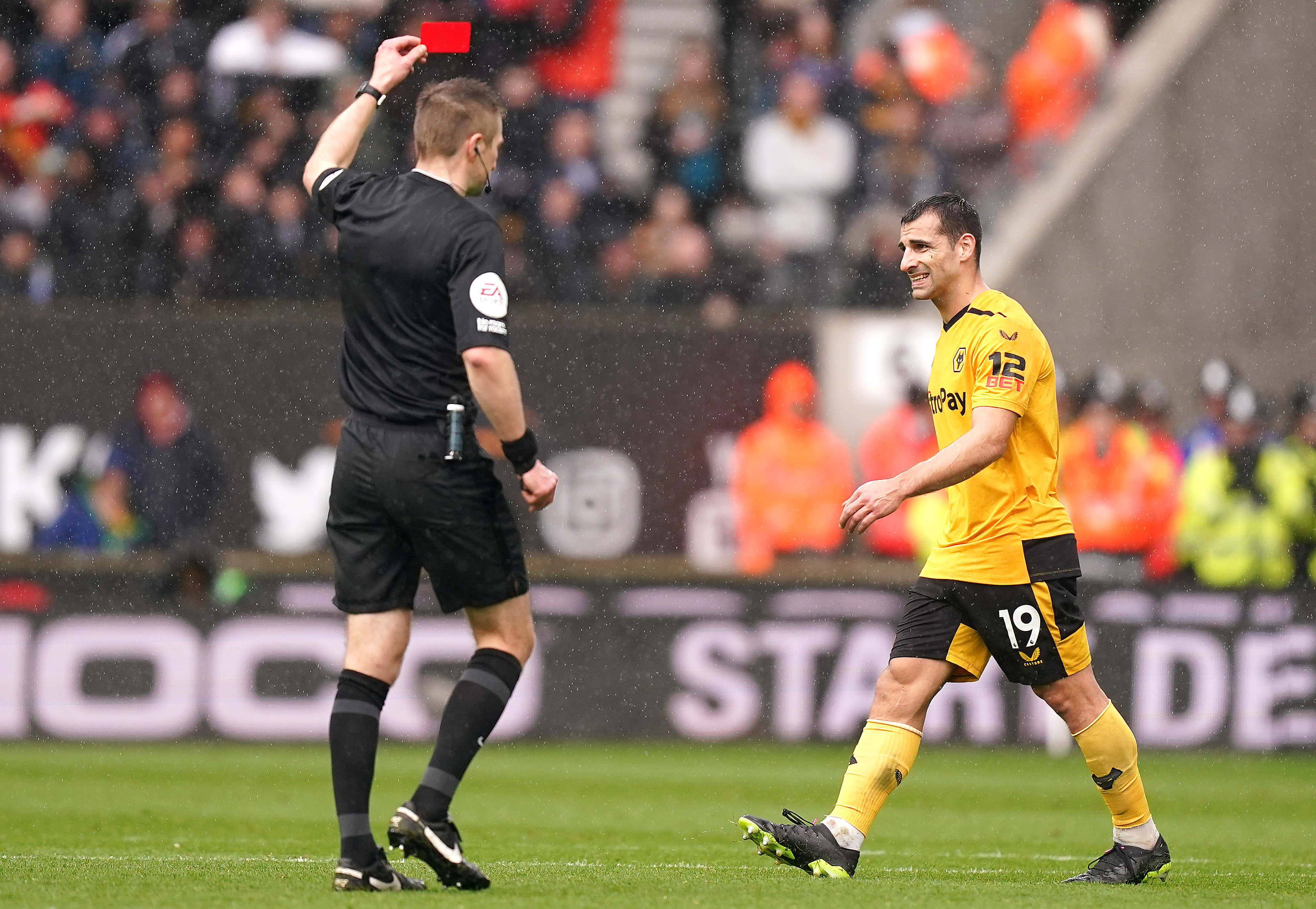 Michael Salisbury shows a red card to Wolves' Jonny against Leeds