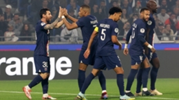 Lionel Messi and Kylian Mbappe celebrate during the win over Lyon