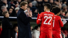 Julian Nagelsmann in discussion with Joao Cancelo