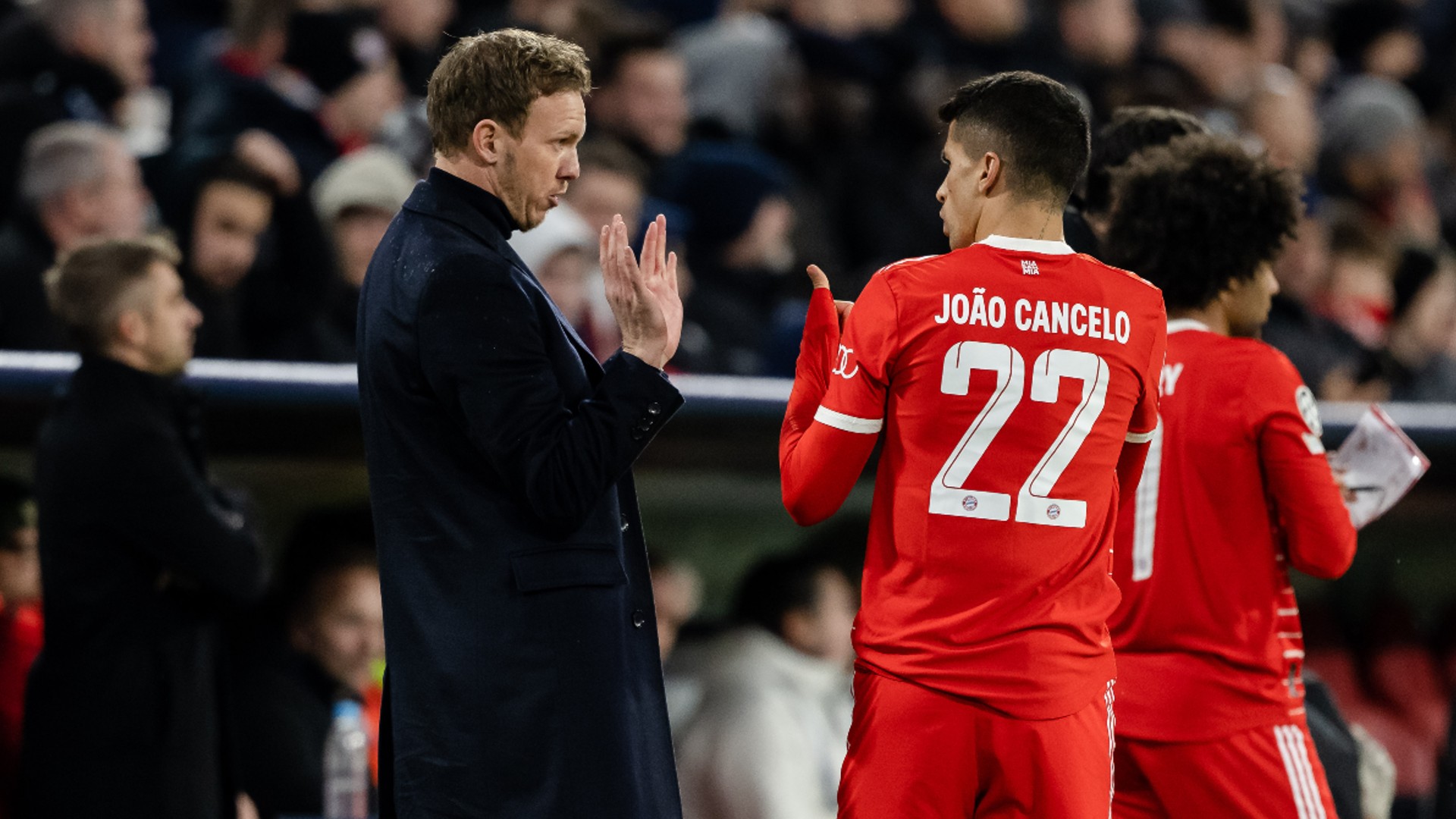 Julian Nagelsmann in discussion with Joao Cancelo
