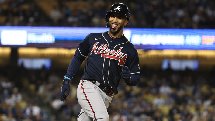 Eddie Rosario #8 of the Atlanta Braves celebrates a three run home run during the ninth inning of Game Four of the National League Championship Series against the Los Angeles Dodgers