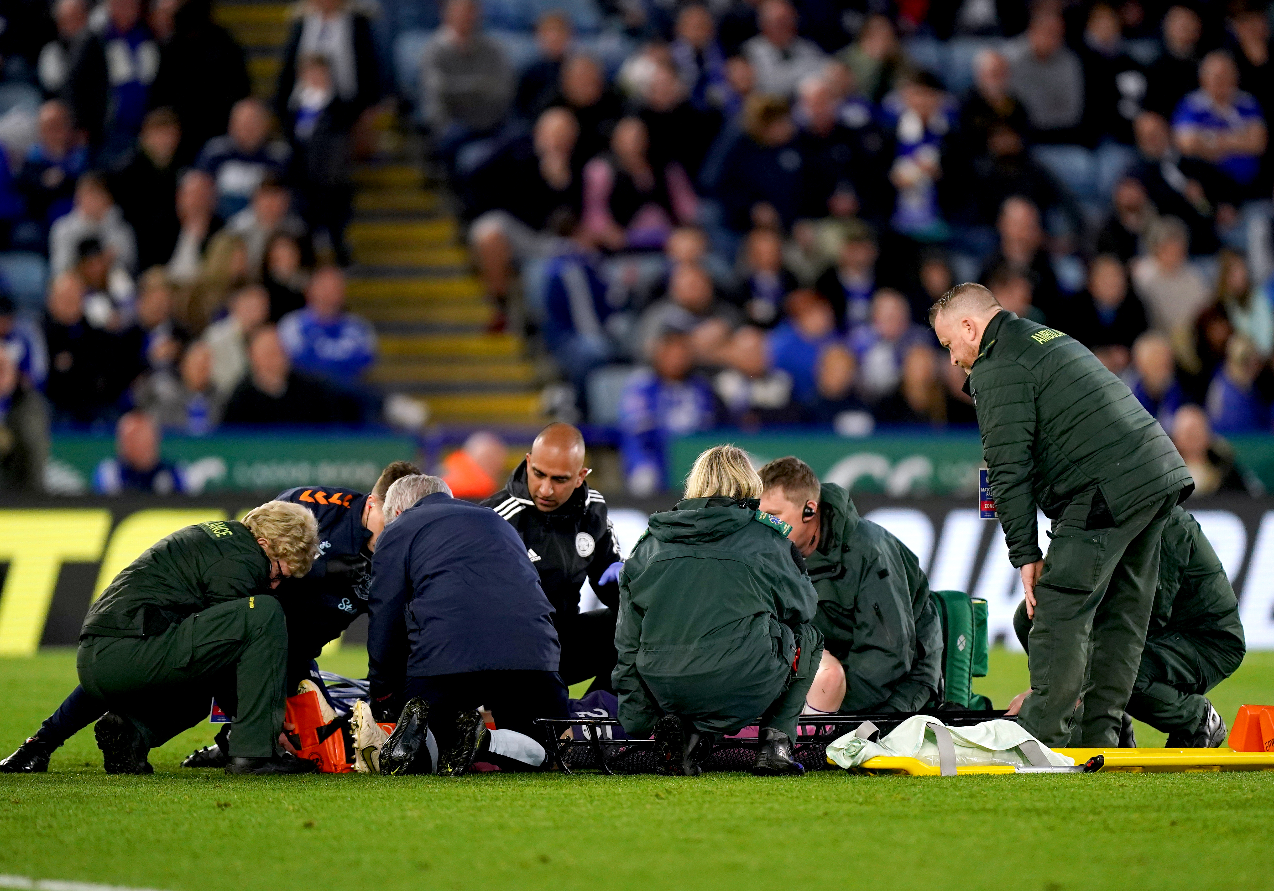 Everton’s Seamus Coleman is placed on a stretcher after suffering a knee injury at Leicester