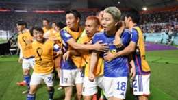 Takuma Asano celebrates after scoring Japan's second goal against Germany