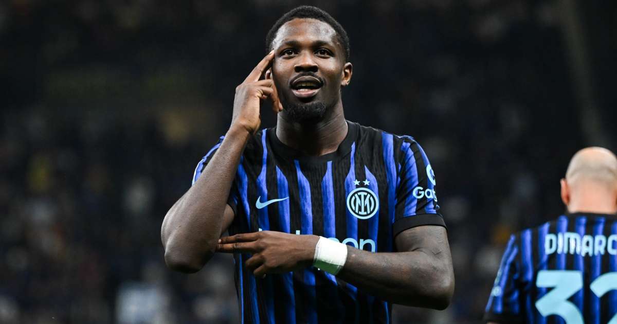 Marcus Thuram celebrates after scoring for Inter Milan against Cagliari