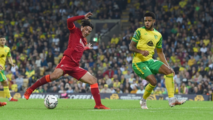 Takumi Minamino scores his second and Liverpool's third goal at Norwich