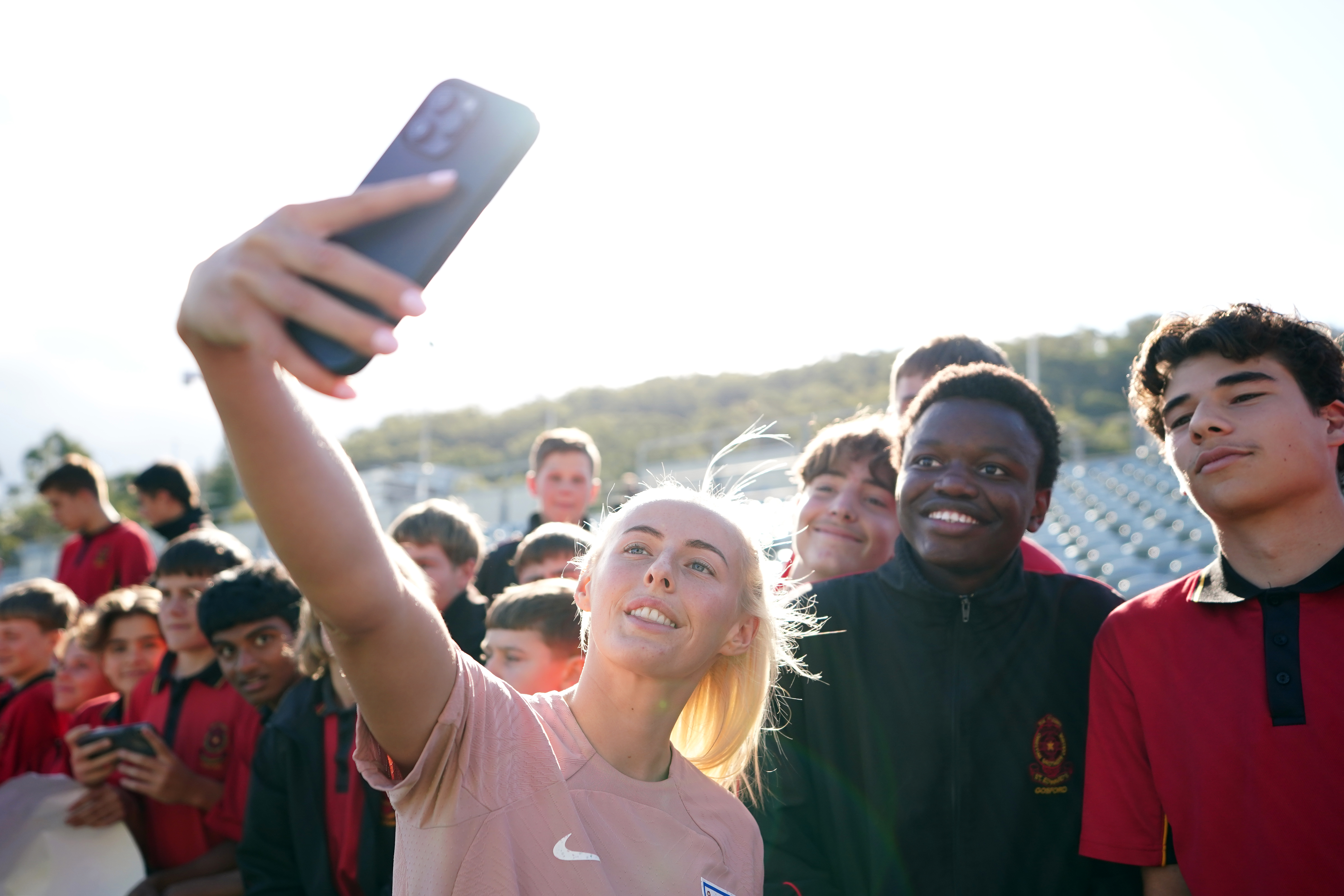 England’s Chloe Kelly stopped for photos with fans after a training session at Central Coast Stadium