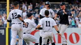 The Yankees celebrate Kyle Higashioka's game-winning hit