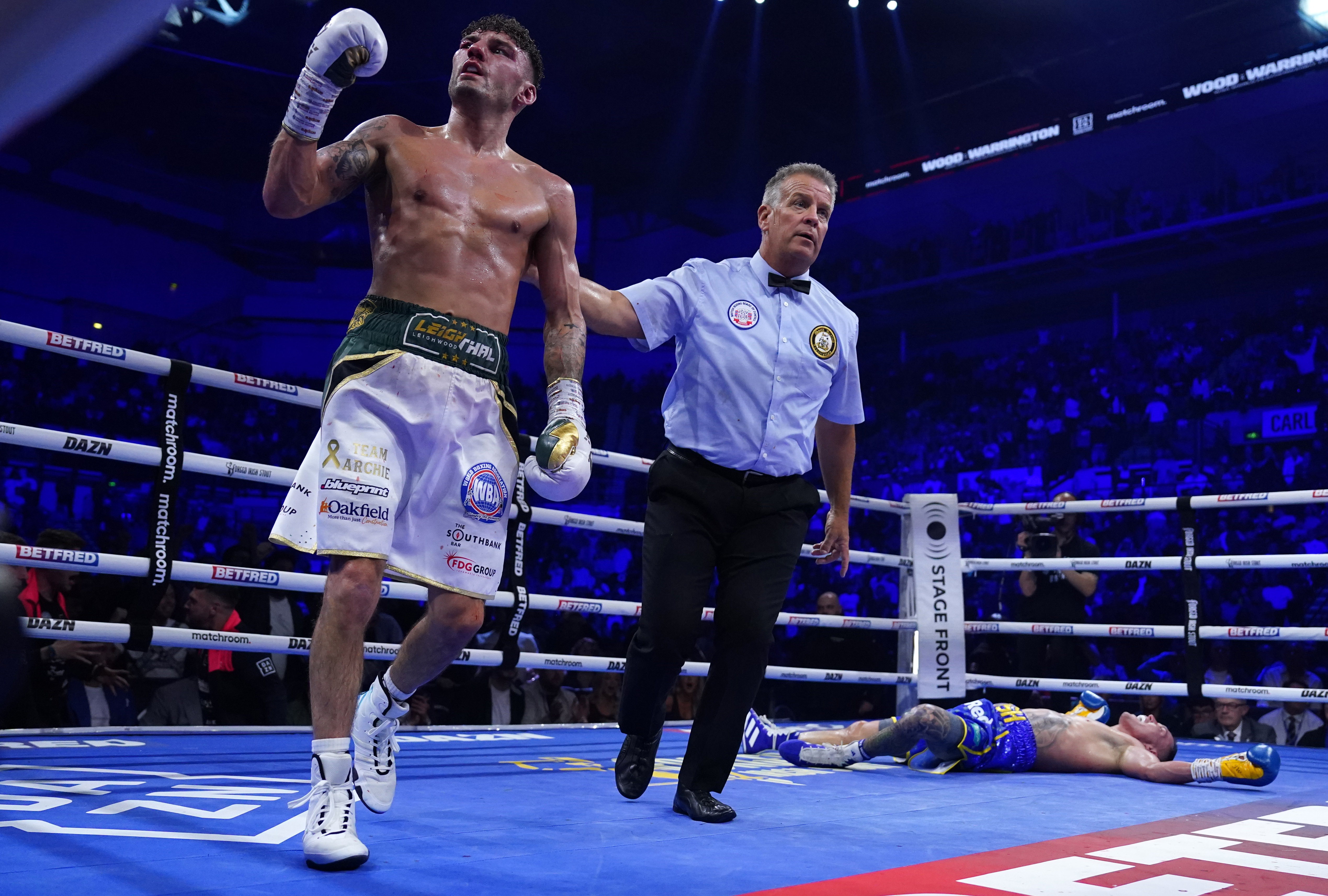 Leigh Wood knocked down Josh Warrington in the seventh round to claim victory