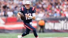 New England Patriots quarterback Mac Jones limped off the field after his last throw of the game