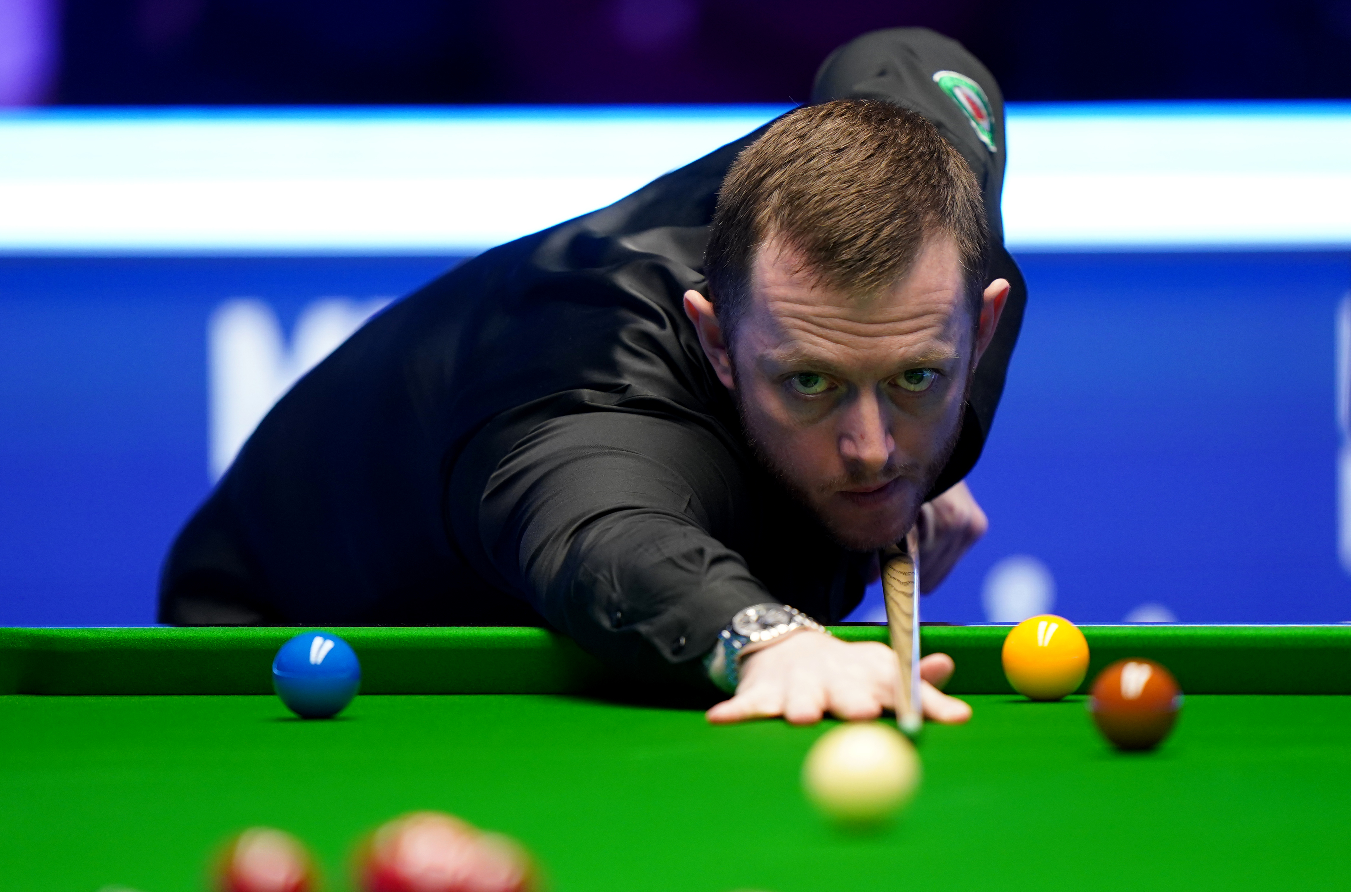 Mark Allen plays a shot