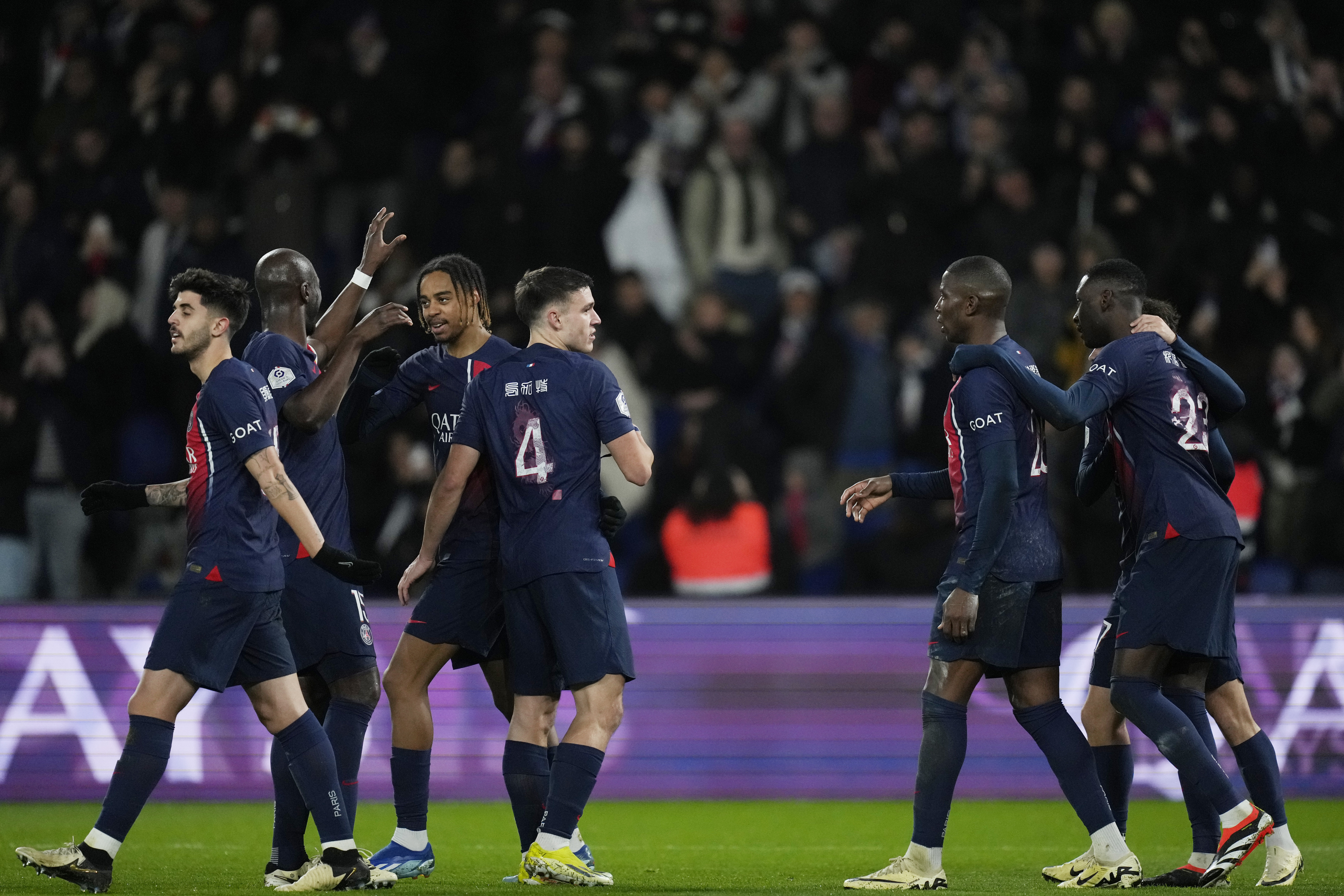 PSG celebrate after Randal Kolo Muani wraps up victory over Lille