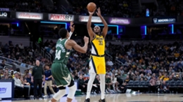 Sweet-shooting center Myles Turner puts one up over Giannis Antetokounmpo