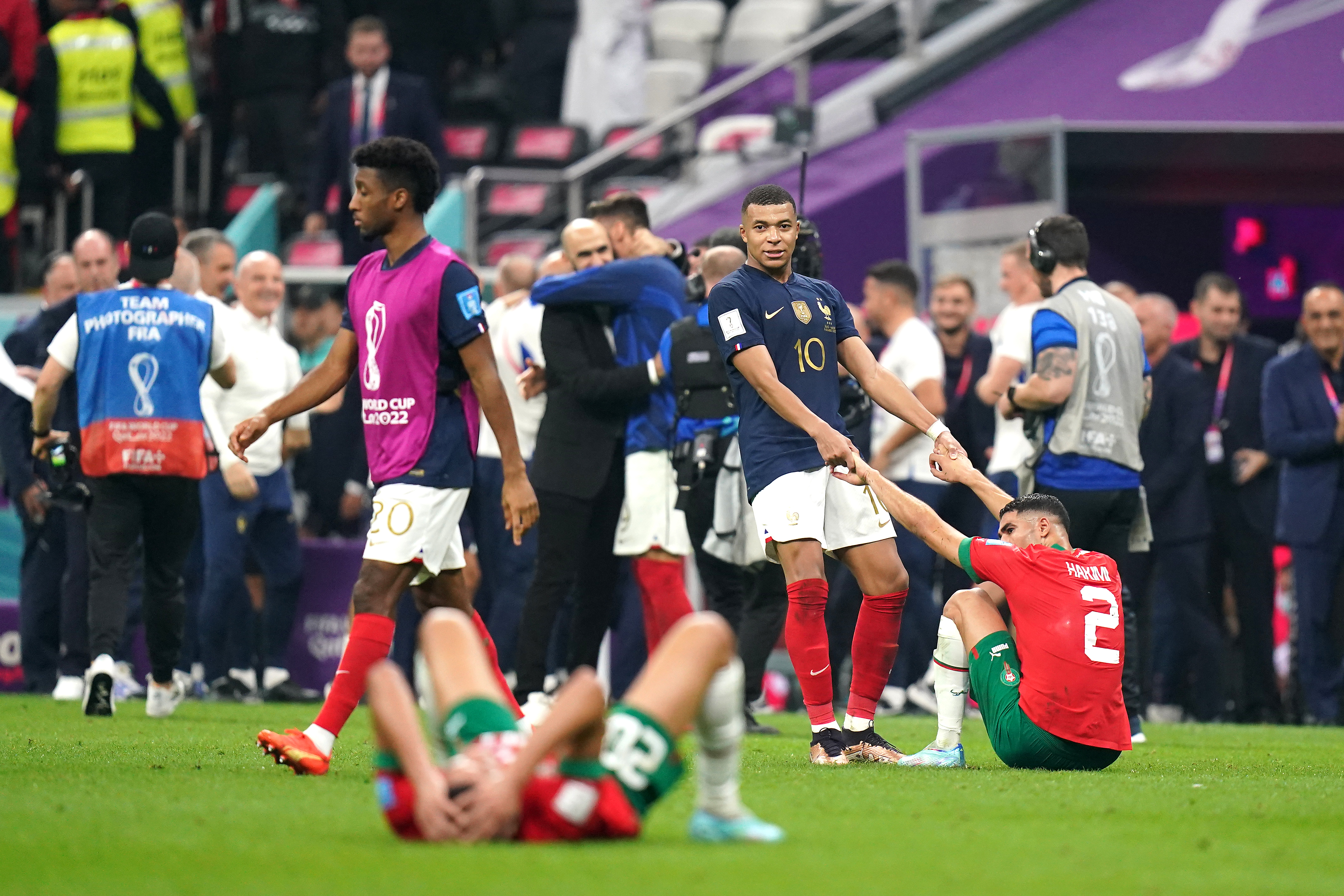 France’s Kylian Mbappe helps up Morocco’s Achraf Hakimi (right) after the final whistle in the World Cup semi-final