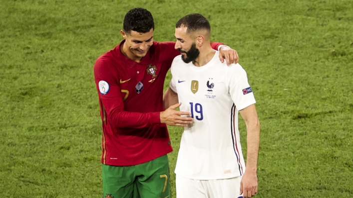 Cristiano Ronaldo embraces Karim Benzema