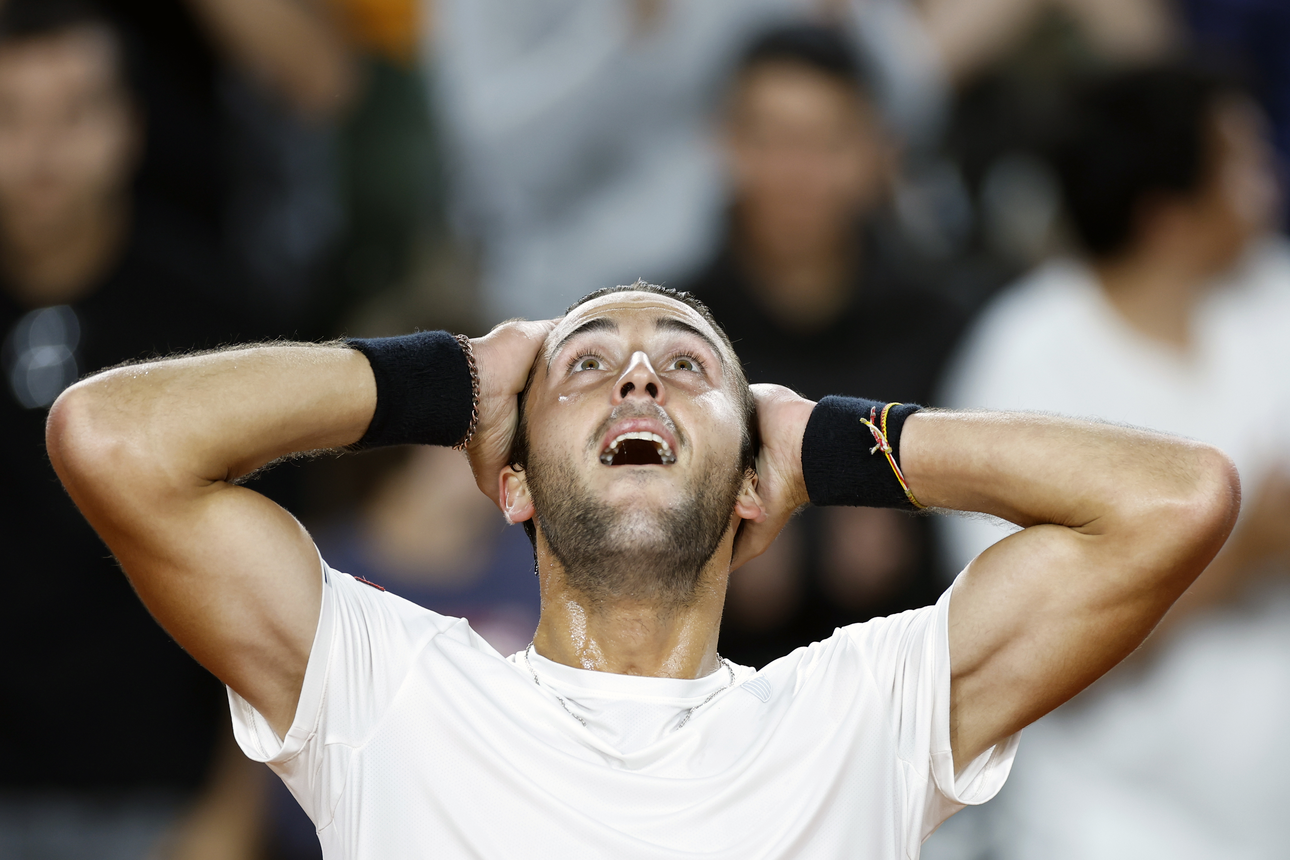 Argentina’s Tomas Etcheverry celebrates reaching a grand slam quarter-final for the first time