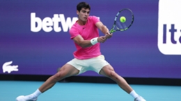Carlos Alcaraz plays a backhand against Facundo Bagnis in their second round match