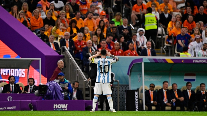 Lionel Messi celebrates in front of the Netherlands dugout
