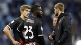 Milan's players look dejected after conceding three times against Inter