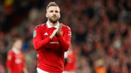 Luke Shaw applauds Manchester United's supporters after their EFL Cup final win