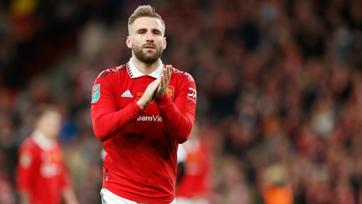 Luke Shaw applauds Manchester United's supporters after their EFL Cup final win