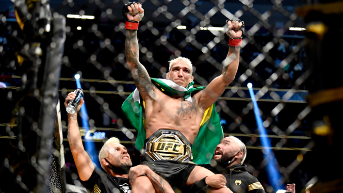 Charles Oliveira of Brazil reacts after being announced the winner by submission against Dustin Poirier after their UFC lightweight championship bout during the UFC 269