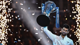 Novak Djokovic holds up the ATP Finals trophy