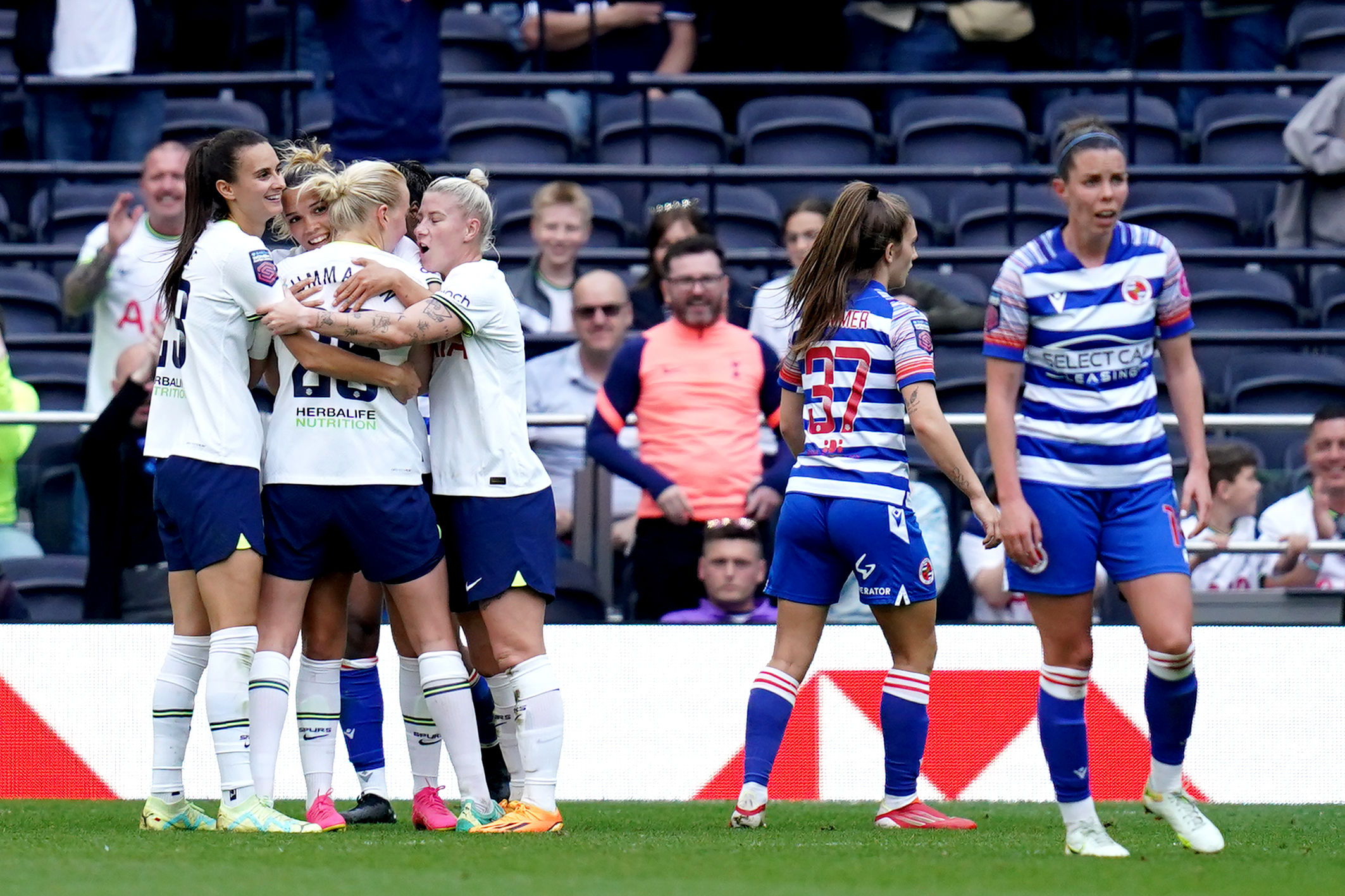 Tottenham players celebrate a goal in their WSL game against Reading