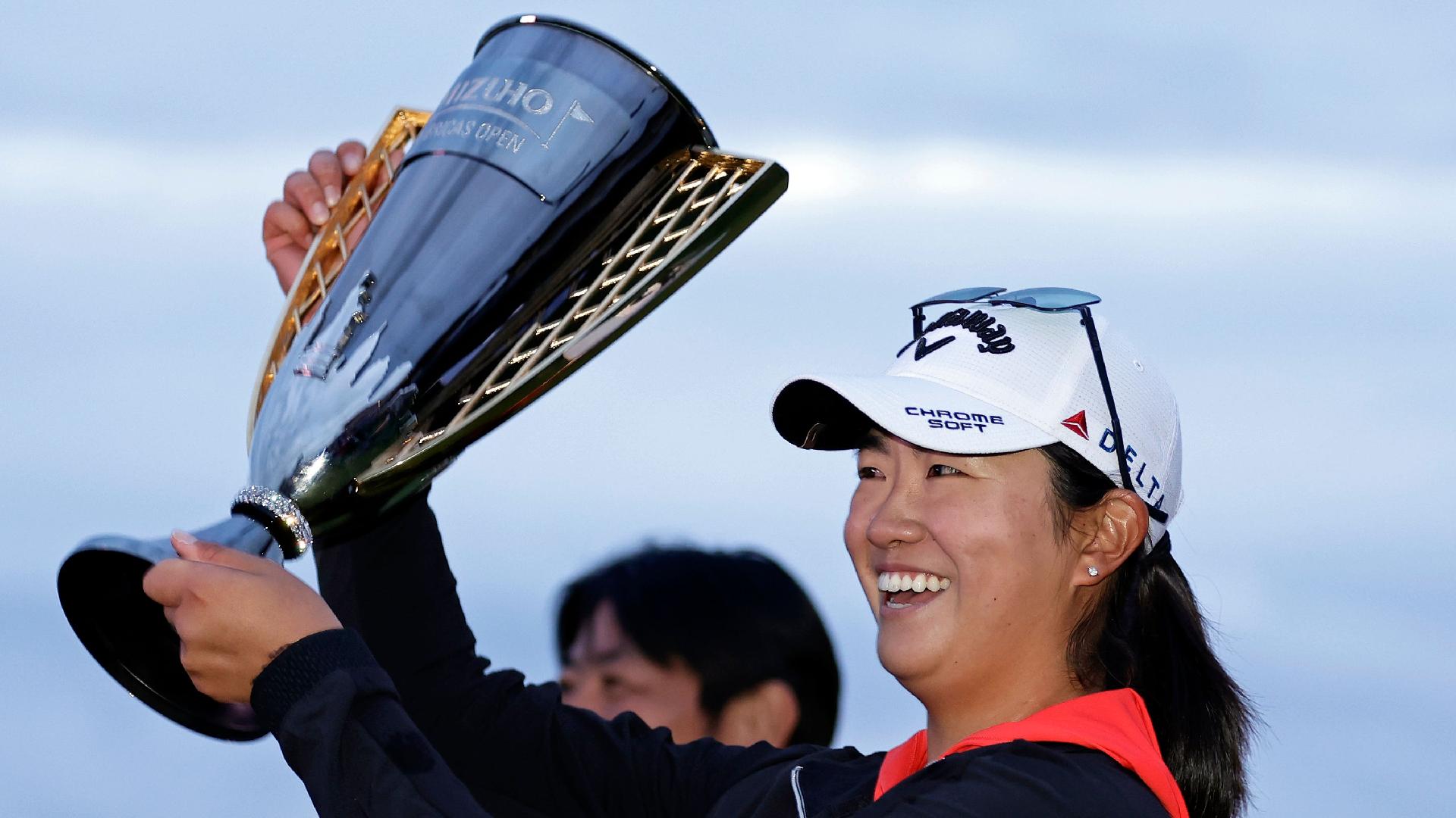 Rose Zhang holds up the trophy after winning the Mizuho Americas Open (Adam Hunger/AP)