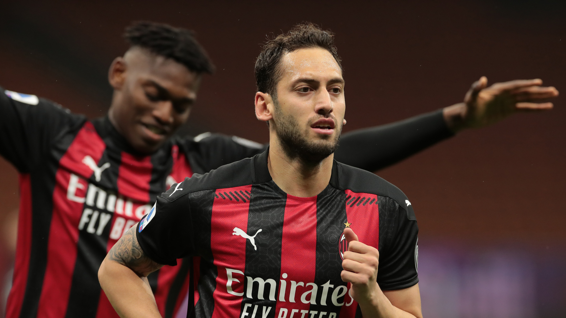 Milan midfielder Hakan Calhanoglu celebrates scoring against Benevento