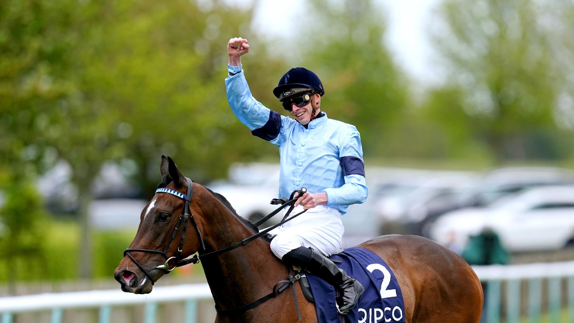 Jockey James Doyle celebrates on Cachet after winning the Qipco 1000 Guineas (David Davies/PA)