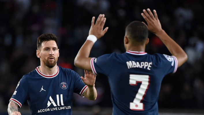 Lionel Messi and Kylian Mbappe celebrate